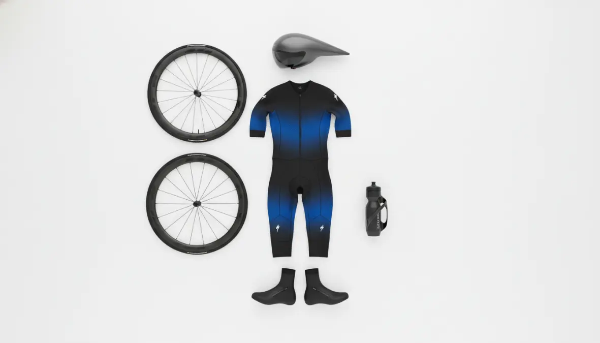 Collection of aerodynamic cycling gear including aero helmet, deep wheels, and clothing for drag reduction