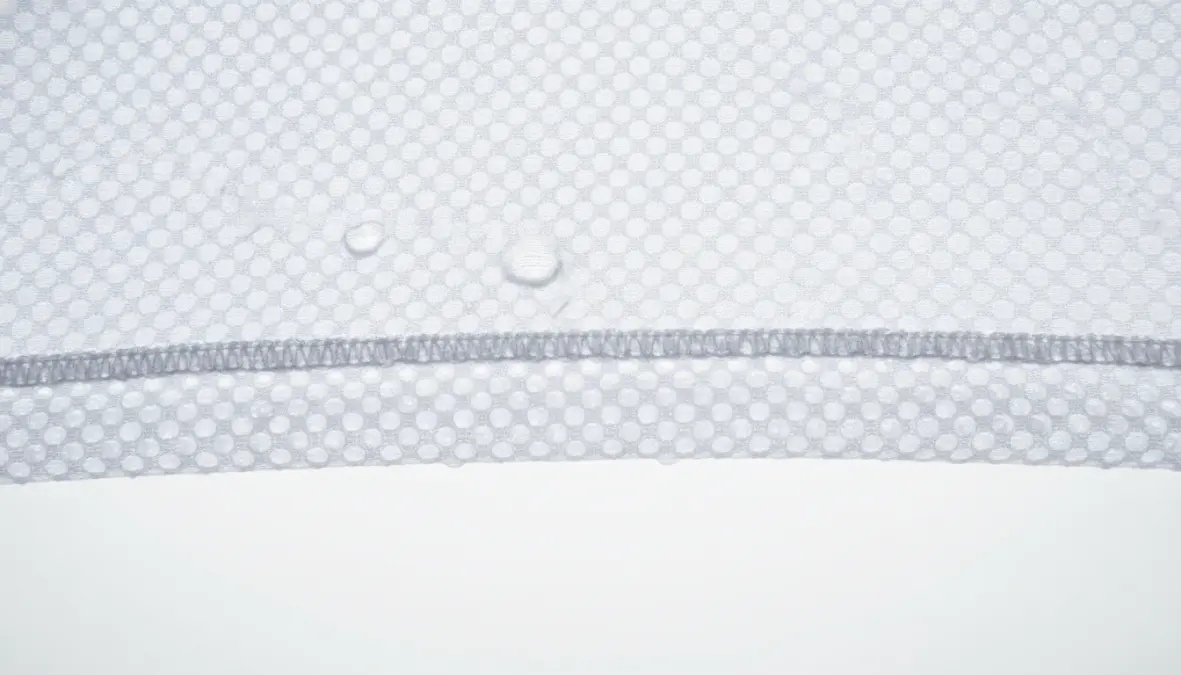 Summer cycling base layer with mesh construction showing breathable moisture wicking fabric detail