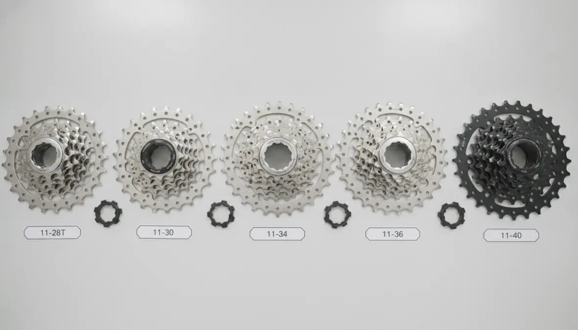 Different cassette ratios comparison showing 11-28, 11-32, and 11-34 options for bicycle gearing