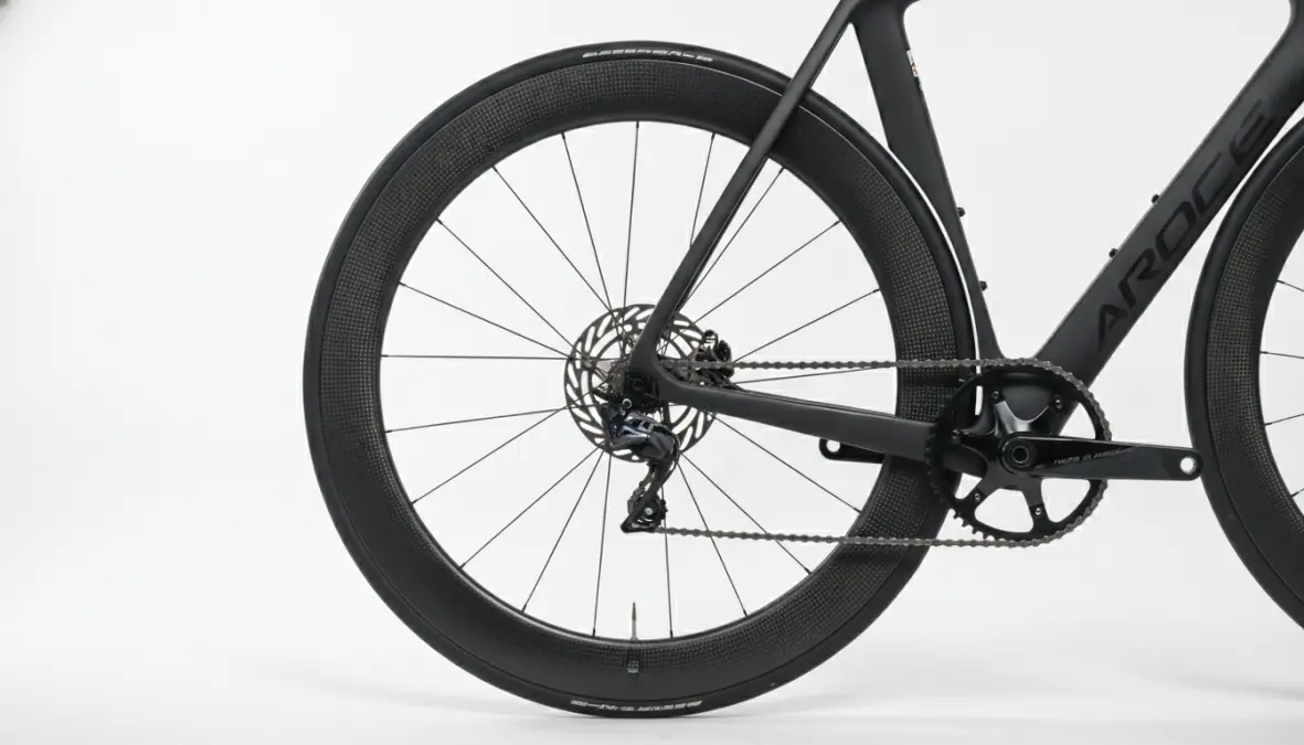 Carbon aero wheels with deep rim depth showing aerodynamic design for racing performance